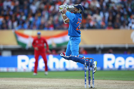 Shikhar Dhawan of India hits a six over backward point off the bowling of Stuart Broad of England during the ICC Champions Trophy Final at Edgbaston on June 23, 2013 in Birmingham, England. (GETTY)