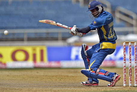 Sri Lankan cricketer Upul Tharanga plays a shot during the third match of the Tri-Nation series against India at the Sabina Park stadium in Kingston on July 2, 2013. (AFP)