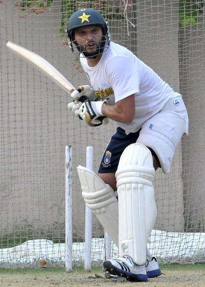 Pakistani cricketer Shahid Afridi bats during practice in Lahore on July 3, 2013. (AFP)