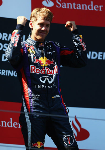 Sebastian Vettel of Germany and Infiniti Red Bull Racing celebrates on the podium after winning the German Grand Prix at the Nuerburgring on July 7, 2013 in Nuerburg, Germany. (GETTY)
