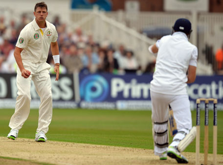 Australia's James Pattinson (left) reacts to England captain Alastair Cook during the first day's play of the first Test of the 2013 Ashes series at Trent Bridge in Nottingham, England on July 10, 2013. (AFP)
