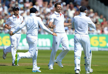 England's James Anderson (second right) celebrates with teammates after claiming his fifth wicket during the second day's play of the first Ashes Test against Australia at Trent Bridge in Nottingham on July 11, 2013. (AFP)