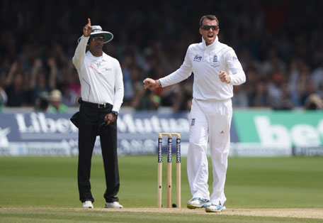 Graeme Swann of England celebrates the wicket of Phil Hughes of Australia as umpire Kumar Dharmasena raises the finger during day four of the 2nd Ashes Test at Lord's Cricket Ground on July 21, 2013 in London, England. (GETTY)