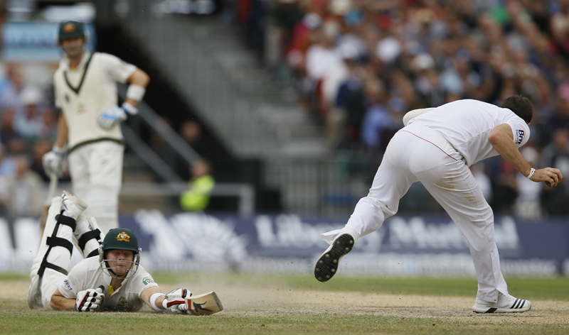 Australia's Steven Smith is run out as captain Michael Clarke watches during day four of the third Ashes Test match held at Old Trafford cricket ground in Manchester, England, Sunday, Aug. 4, 2013. (AP)