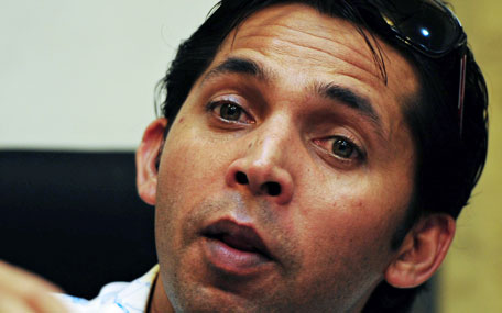 Disgraced former Pakistan fast bowler Mohammad Asif speaks during a news conference in Karachi on August 14, 2013. Asif on August 14 apologised for his role in a notorious 2010 cricket spot-fixing scandal, admitting his guilt for the first time and accepting a five-year ban. (AFP)