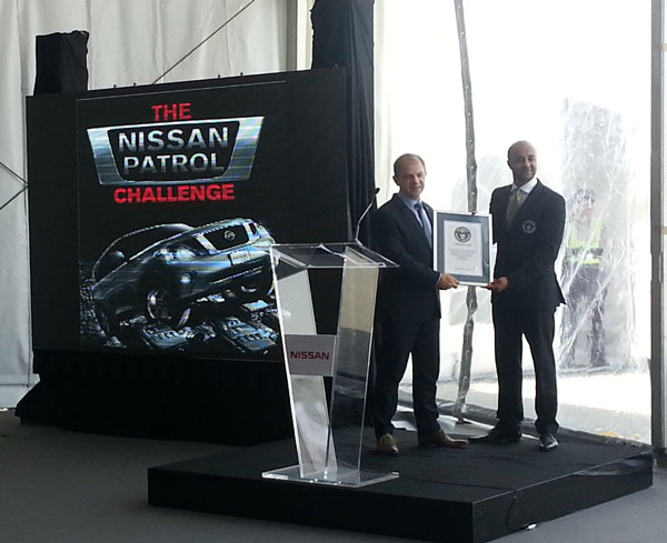 Samir Cherfan (left) receives the Guinness certificate at Sharjah International Airport on Thursday.