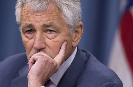 Defense Secretary Chuck Hagel pauses during a news conference at the Pentagon in Washington. Hagel is suggesting Friday, Aug. 23, 2013, that the Pentagon is moving naval forces closer to Syria in case President Barack Obama decides to order military strikes. (AP)