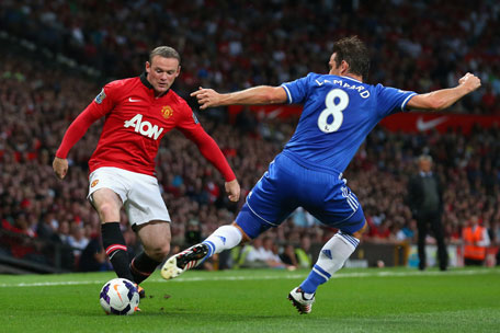 Wayne Rooney of Manchester United is challenged by Frank Lampard of Chelsea during the Barclays Premier League match at Old Trafford on August 26, 2013 in Manchester, England. (GETTY)