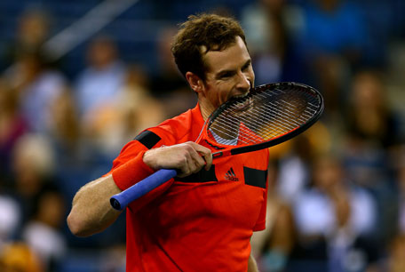 Andy Murray of Great Britain bites his racket during his men's singles fourth round match against Denis Istomin of Uzbekistan on Day Nine of the 2013 US Open at USTA Billie Jean King National Tennis Center on September 3, 2013 in New York City. (AFP)
