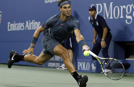 Rafael Nadal of Spain returns a volley to compatriot Tommy Robredo during their men's quarter-final match at the US Open in New York September 4, 2013. (REUTERS)