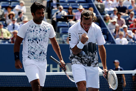 Radek Stepanek of Czech Republic and Leander Paes of India celebrate a point during their men's doubles semifinal against Bob Bryan and Mike Bryan of the United States of America on Day 11 of the 2013 US Open at USTA Billie Jean King National Tennis Center on September 5, 2013 in New York City. (GETTY)