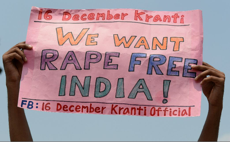 An Indian activist holds a placard during a  protest outside the Saket Court complex in New Delhi on September 11, 2013. Four men convicted of the gang rape and murder of a student on a New Delhi bus last December were sentenced to death on September 13, 2013. "Diabolical" crime had shocked the country's conscience. (AFP)