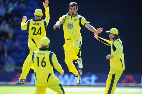 Australia's Clint Mckay (centre) celebrates after completing his hat-trick by dismissing England batsman Joe Root during the 4th NatWest Series ODI at SWALEC Stadium on September 14, 2013 in Cardiff, Wales. (GETTY)