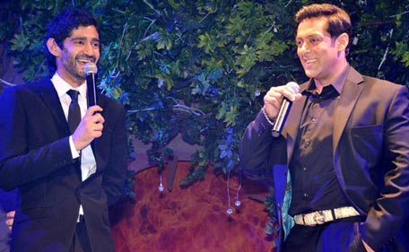 Actor Salman Khan (R) interacts with the moderator Gaurav Kapoor (L) during the launch of reality show 'Bigg Boss 7'. (Pic: ColorsTV)