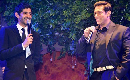 Actor Salman Khan (R) interacts with the moderator Gaurav Kapoor (L) during the launch of reality show 'Bigg Boss 7'. (Pic: ColorsTV)