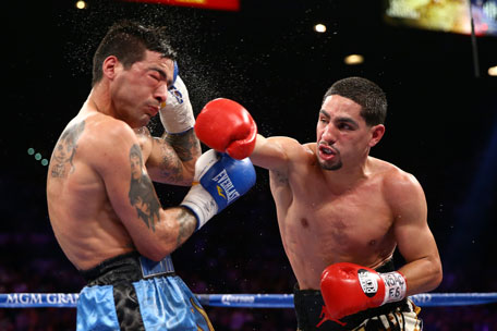 Danny Garcia throws a right to the head of Lucas Matthysse during their WBC/WBA super lightweight title fight at the MGM Grand Garden Arena on September 14, 2013 in Las Vegas, Nevada. (GETTY)