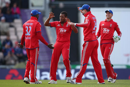 Chris Jordan (second left) of England celebrates with Michael Carberry (left) after capturing the wicket of Phil Hughes of Australia during the 5th NatWest Series ODI at the Ageas Bowl on September 16, 2013 in Southampton, England. (GETTY)
