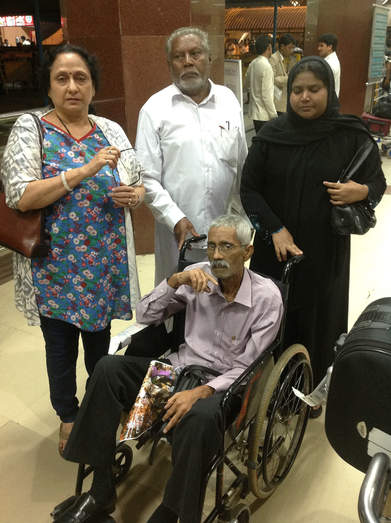 Well known Dubai-based Indian social worker Umarani Padmanabhan (extreme left) with cancer patient Abdul Sattar in wheel chair and his family members at the airport after reaching India on August 27.