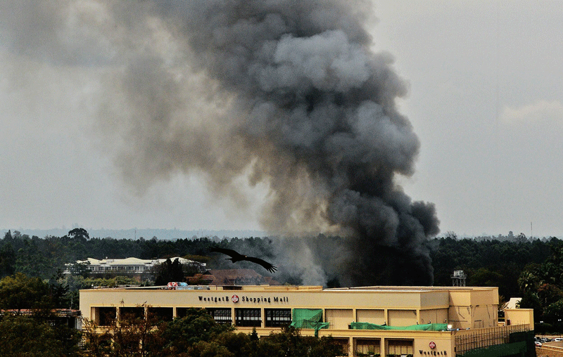 Smoke rises from the Westgate mall in Nairobi on September 23. Kenyan troops were locked in a fierce firefight with Somali militants inside the upmarket Nairobi shopping mall in a final push to end the siege.  (AFP)