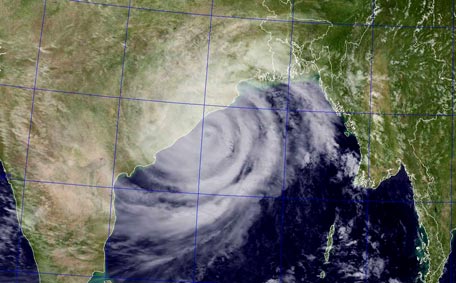This October 12, 2013 satellite image obtained from the US Naval Research Laboratory (NRL) shows Tropical Cyclone Phailin over the Bay of Bengal. India evacuated half a million people as massive Cyclone Phailin closed in on the impoverished east coast Saturday, with winds already uprooting trees and tearing into flimsy homes. (AFP)