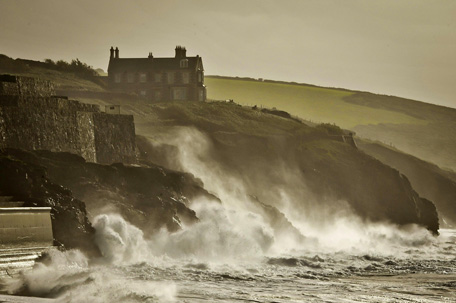 Waves crash onto the cliffs surrounding Porthleven, Cornwall, southwest England. (AP)