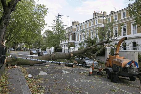 A tree lies across the road on Camden Square on October 28, 2013 in London, England. Approximately 220,000 homes are without power and two deaths have been recorded after much of southern England has been affected by a severe storm. Transport links on road, rail, air and sea have been severely disrupted by hurricane-force winds that have almost reached 100 mph in places.  (Getty Images)