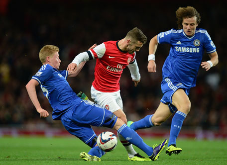 Jack Wilshere of Arsenal is tackled by Kevin De Bruyne (left)  of Chelsea during the Capital One Cup Fourth Round match at the Emirates Stadium on October 29, 2013 in London, England. (GETTY)