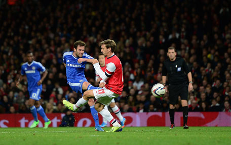 Juan Mata of Chelsea shoots to score his side's second goal during the Capital One Cup Fourth Round match against Arsenal at the Emirates Stadium on October 29, 2013 in London, England. (GETTY)