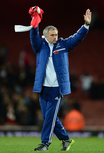 Chelsea manager Jose Mourinho celebrates after his side won the Capital One Cup Fourth Round match against Arsenal at the Emirates Stadium on October 29, 2013 in London, England. (GETTY)