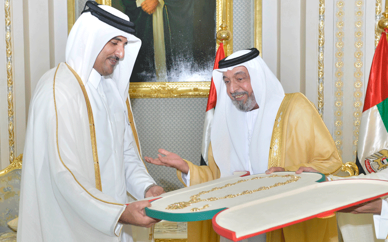 Sheikh Tamim bin Hamad Al Thani, the Emir of Qatar, receiving the Zayed Medal from The President His Highness Sheikh Khalifa bin Zayed Al Nahyan, at Al Rawda Palace in Al Ain city on Thursday. (Wam)
