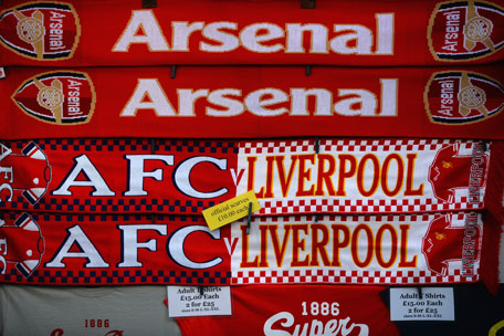 Football scarves and t-shirts are sold on a temporary street stall ahead of the Barclays Premier League match between Arsenal and Liverpool at Emirates Stadium on November 2, 2013 in London, England. (GETTY)