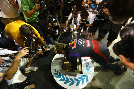 Sebastian Vettel of Germany and Infiniti Red Bull Racing has his hands set in concrete after winning the Abu Dhabi Formula One Grand Prix at the Yas Marina Circuit on November 3, 2013 in UAE. (GETTY)