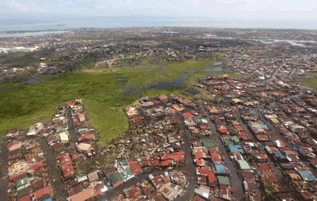This handout photograph taken on November 10, 2013 and released by the Malacanang Photo Bureau (MPB) shows an aerial view of the damage in Leyte following Super Typhoon Haiyan in the area. The death toll from a super typhoon that decimated entire towns in the Philippines could soar well over 10,000, authorities warned Sunday, making it the country's worst recorded natural disaster. (AFP)