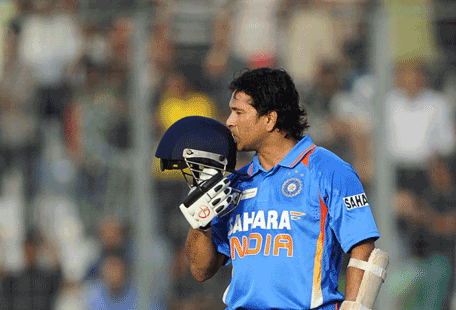 Indian batsman Sachin Tendulkar kisses his helmet after scoring his hundredth century (100 runs) during the one day international (ODI) Asia Cup cricket match between India and Bangladesh at the Sher-e-Bangla National Cricket Stadium in Dhaka.  India will lose its greatest cricketer when Sachin Tendulkar retires but the 'Little Master' leaves behind records that will not only be tough to beat, but may never be broken. (AFP/File)