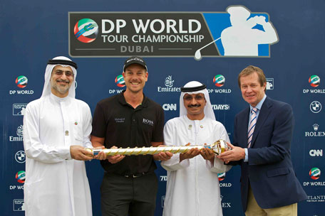 DP World Tour Championship winner Henrik Stenson receives his trophy from Mohammed Sharaf (Group CEO DP World), Sultan bin Sulayem (Chairman DP World) and George O'Grady (Chief Executive, The European Tour). (SUPPLIED)