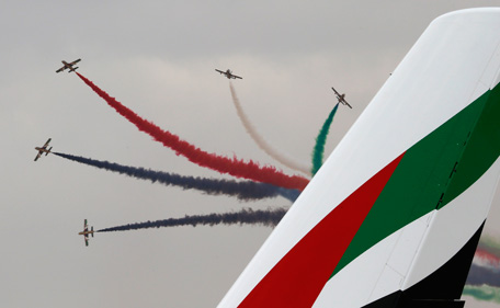Al Fursan, the aerobatics demonstration team of the United Arab Emirates Air Force, performs during the Dubai Airshow November 17, 2013. (REUTERS)
