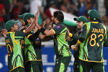 Pakistan captain Mohammad Hafeez and Shahid Afridi of Pakistan are congratulated for getting South African captain Faf du Plessis wicket during the 2nd T20 International at Sahara Park Newlands on November 22, 2013 in Cape Town, South Africa. (GETTY)