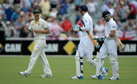 Mitchell Johnson of Australia exchanges words with Stuart Broad and Matt Prior of England as they leave the field at the end of day four of the Second Ashes Test at Adelaide Oval on December 8, 2013 in Adelaide, Australia. (GETTY)