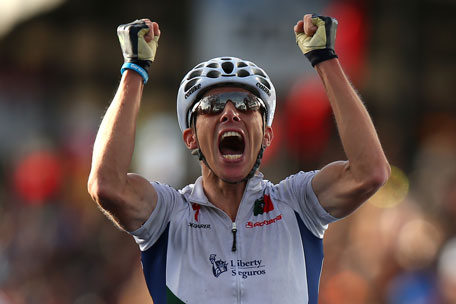 Rui Costa of Portugal celebrates crossing the finish line to win the Elite Men's Road Race on September 29, 2013 in Florence, Italy. (GETTY)