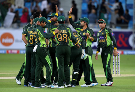 Pakistan celebrate after dismissing TM Dilshan of Sri Lanka during the first Twenty20 International at Dubai International Cricket Stadium on December 11, 2013 in Dubai, UAE. (GETTY)