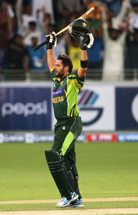 Shahid Afridi of Pakistan celebrateS after hitting the winning runs during the first Twenty20 International against Sri Lanka at Dubai Sports City Cricket Stadium on December 11, 2013 in UAE. (GETTY)