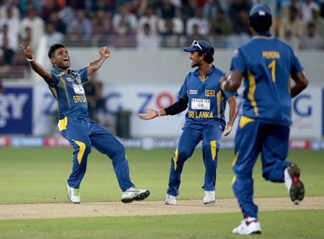 Seekuge Prasanna of Sri Lanka celebrates after dismissing Sharjeel Khan of Pakistan during the second Twenty20 International at Dubai Sports City Cricket Stadium on December 13, 2013 in UAE. (GETTY)