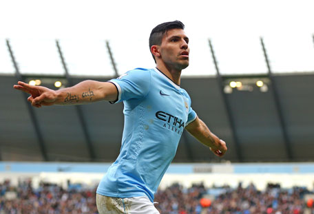 Sergio Aguero of Manchester City celebrates after scoring the opening goal during the Barclays Premier League match between Manchester City and Arsenal at Etihad Stadium on December 14, 2013 in Manchester, England.  (GETTY)