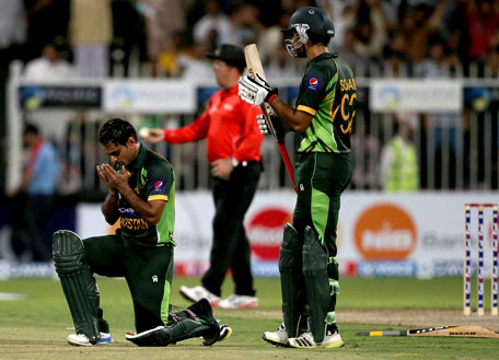 Mohammad Hafeez of Pakistan offers a prayer after reaching a century during the first one-day iInternational against Sri Lanka at the Sharjah Cricket Stadium on December 18, 2013 in UAE. (GETTY)