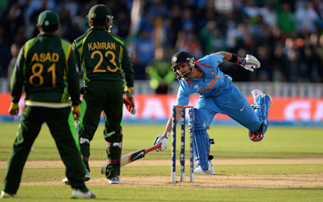 Virat Kohli of India makes his ground to score the winning run during the ICC Champions Trophy match between India and Pakistan at Edgbaston on June 15, 2013 in Birmingham, England. (GETTY)