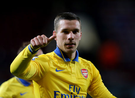 Lukas Podolski of Arsenal celebrates victory after the Barclays Premier League match between West Ham United and Arsenal at Boleyn Ground on December 26, 2013 in London, England. (GETTY)