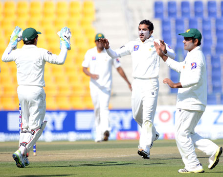 Pakistan's Bilalawal Bhatti celebrates taking a wicket during the opening day of the first Test between Pakistan and Sri Lanka at Sheikh Zayed Cricket Stadium in Abu Dhabi on December 31, 2013. (KAMAL JAYAMANNE)