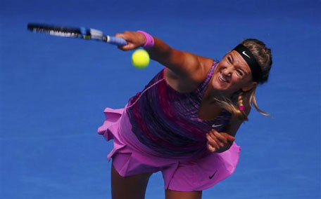 Victoria Azarenka of Belarus serves to Sloane Stephens of the US during their women's singles match at the Australian Open 2014 tennis tournament in Melbourne January 20, 2014. (REUTERS)
