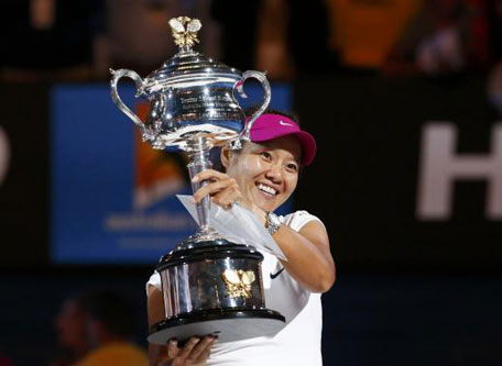 Li Na of China poses with the Daphne Akhurst Memorial Cup after defeating Dominika Cibulkova of Slovakia in their women's singles final match at the Australian Open 2014 tennis tournament in Melbourne January 25, 2014. (REUTERS)