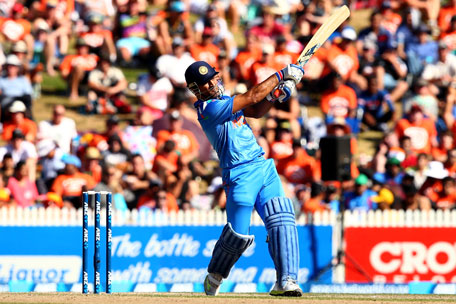 MS Dhoni of India hammers a boundary during game four of the one-day international series between New Zealand and India at Seddon Park on January 28, 2014 in Hamilton, New Zealand. (GETTY)